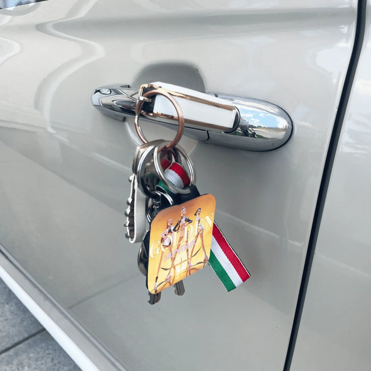 Custom Keychain with a flag attached to a car door handle