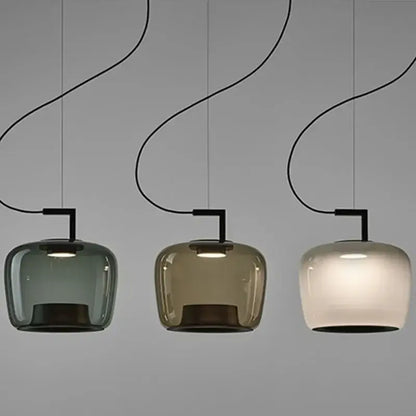 Danish glass pendant light in three colors hanging from the ceiling, showcasing a sleek and modern design.