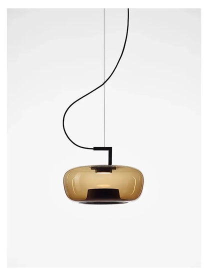 Modern pendant light with a glass shade on a white background