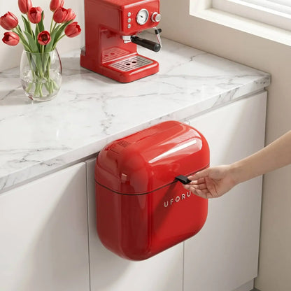Kitchen Waste Bin and on a kitchen counter with a vase of tulips and an espresso machine.