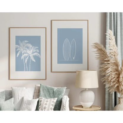 Living room with framed artwork, lamp, and decorative plant