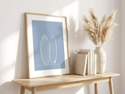 Tropical Coastal Wall Art on a wooden console table with books and a vase.